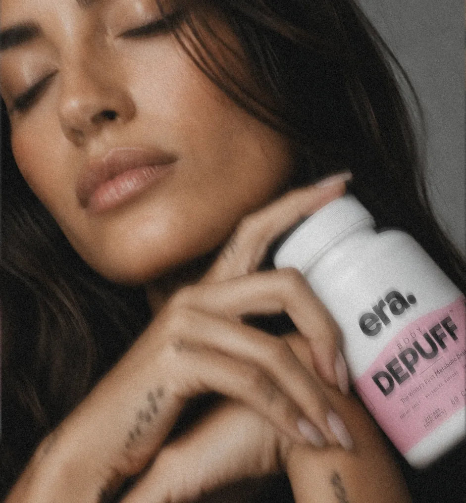 woman with eyes closed cradling the bottle, soft film photograph